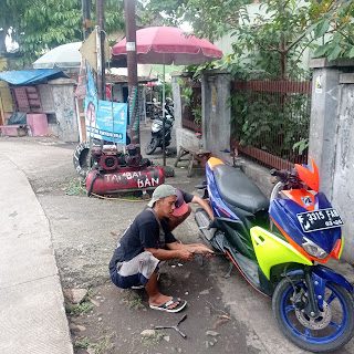 Tambal ban Poy domoro